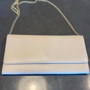 Tan crossbody/clutch with gold shoulder strap